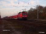 114 007-8 schiebt ein RE 1 Brandenburg durch Berlin-Friedrichshain.