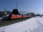 182 010+014 ziehen bei Niederaudorf mit einem Sattelauflieger nach Rosenheim.