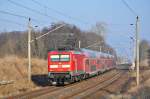 Die 112 103 fährt am  saukalten  26.01.2014 mit dem RE 4308 (Rostock-Hamburg)durch Sildemow in Richtung Schwerin.