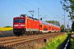 Mit eine RE aus der Lutherstadt Wittenberg kommend hat die 112 103 am 07.05.2014 Rostock Hbf fast erreicht.Hier in Sildemow.