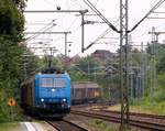 AlphaTrains/CFL Cargo 185 518-8 mit dem Spanplattenzug festgehalten bei der Durchfahrt in Schleswig am 31.08.2014