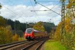   Der RE 9 - Rhein Sieg Express (RSX) Aachen - Köln - Siegen, bestehend aus zwei gekuppelten vierteiligen Bombardier Talent 2 - 442 755 / 255 und 442 758 / 258, fährt am  26.10.2014 durch