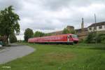 610 003 mit einer leer Garnitur nach Hof in Wiesau/Oberpfalz.