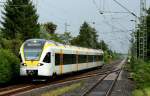 Am 16.08.2014 ist der ET 7.02 der Eurobahn als RE 13 Maas-Wupper-Express bei Kleinenbroich in Richtung Venlo/Niederlande unterwegs