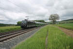 185 569-1 zieht mit einem Hödlmayr Autotransportzug bei Retzbach-Zellingen gen Süden. 18.05.24