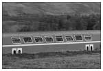 Im Erdboden teilweise  abgesunken  Doppelstockwagen.