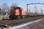 Mit einige Niederbordwagen passiert 6442 Hulten am 19 Jäner 2024 und wird vom offenbarer Weg fotografiert.