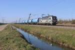 RFO 193 134 zieht ein Kesselwagenzug durch Valburg am 6 März 2025.