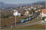 Ein ABDe 8/8 mit seinem Regionalzug bei Planchamp.