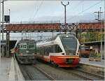 Die ehemalige Prototyp Re 4/4 II verkehrt nun bei der BLS als Re 420 508; hier gerade aus Bern in Neuchâtel angekommen. Daneben steht der RTV/TRN Flirt RABe 527 331. 

2. Okt. 2008