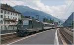 Die SBB Re 4/4 II 11161 erreicht mit einem  Gotthard-IR  Faido.