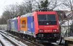 Nachschuss auf das aus Basel kommende Loktrio 421 371-6/484 013/482 039-5, das am 14.02.2021 durch Neuss Sd in Richtung Krefeld fhrt