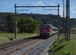 Fussballsonderzug mit Re 4/4 II 11194 und einigen noch immer grünen EW-IV-Wagen.