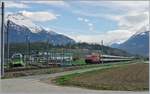 Während der TPC Beh 2/6 542 in Kürze Aigle erreicht, hat die SBB Re 460 mit ihrem IR den Ort vor wenigen Minuten verlassen und strebt nun dem Wallis zu.