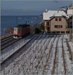 Bei St-Saphorin ist die SBB Re 6/6 11639 unterwegs. 
30. Dez. 2014