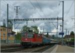 SBB Re 4/4 II 11303 mit einem bunt gemischten IR in Liesstal.