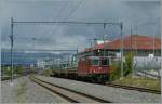 SBB Re 4/4 II 11253 mit einem Schotterzug bei Prilly-Malley.