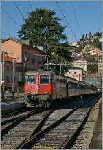 SBB Re 4/4 II 11193 mit einem IR in Locarno.