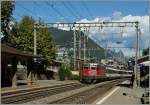 Die SBB Re 4/4 II 11210 mit dem EC 158 vom Milano nach Luzern bei der Durchfahrt in Lugano Paradiso.