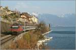 SBB Re 460 073-3 mit eine IR bei St-Saphorin.