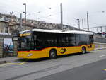 (271'553) - CarPostal Ouest - NE 137'828/PID 12'011 - Mercedes am 1. Februar 2025 beim Bahnhof Neuchtel