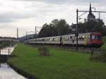 Ein RBe 540, am 03.08.2012 mit seinen Wagen als S 19073 auf der Fahrt von Zürich nach Romanshorn, hat soeben die Station Bürglen passiert.