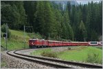 Die RhB Ge 4/4 602 und 603 mit dem Albulaschnellzug 1145 von Chur nach St.Moritz, welcher zusätzlich noch die GEX 900 Wagengruppe von Zermatt mit führt oberhalb von Bergün / Bravuogn.
11. Sept. 2016
   