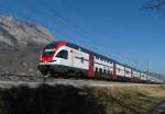 Rheintal-Express RE 3815, RABe 511 028, auf der Fahrt von Wil über St. Gallen nach Chur am 07.03.2014 bei Sennwald.