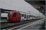 Ganz neu und schon bald  historisch : Der TPF SURF ABe 2/4 104 - B - Be 2/4 104  Dzodezet Express  von Palézieux nach Montbovon im neuen Bahnhof von Châtel St-Denis.