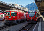   Bahnhof Chur am 01.11.2019:   Links (Gleis 11) steht die RhB Ge 4/4 II – 633   Zuoz  mit Werbung für Radiotelevisiun Svizra Rumantscha (RTR) mit dem RE nach Disentis/Mustér.