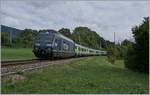 Die BLS Re  465 006 ist mit ihrem RE von La Chaux de Fond nach Bern bei Geneveys sur Coffrane unterwegs.