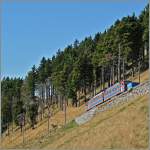 Hat bald ein Ziel erreicht: eine MG Triebwagen auf der Bergfahrt kurz vor der Gipfelstation.