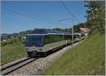 Der MOB Ast 117 in der neuen MOB Farbgebung an einen MOB Panoramic Express auf der Fahrt in Richtung Zweisimmen kurz vor Planchamp.